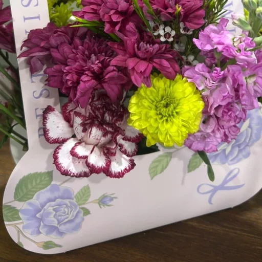 Canasta de flores de estacion